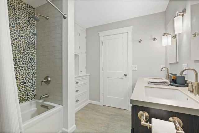 bathroom featuring wood-type flooring, vanity, and shower / bath combo with shower curtain