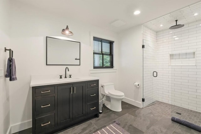 bathroom with vanity, toilet, and an enclosed shower