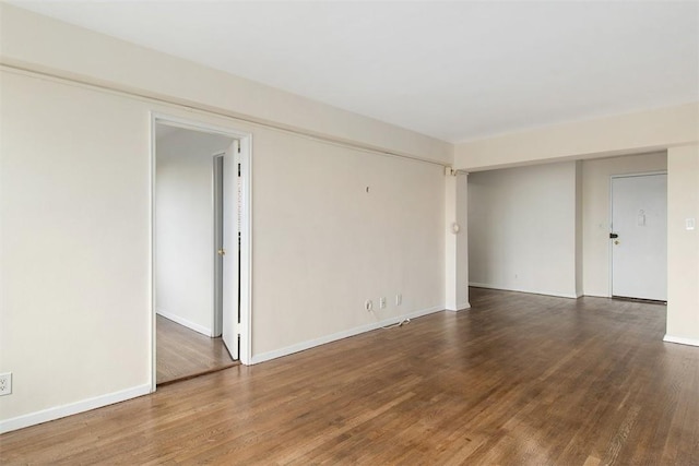 spare room with hardwood / wood-style flooring