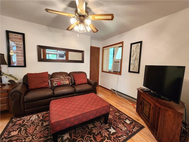 living room featuring ceiling fan, cooling unit, baseboard heating, and light hardwood / wood-style flooring