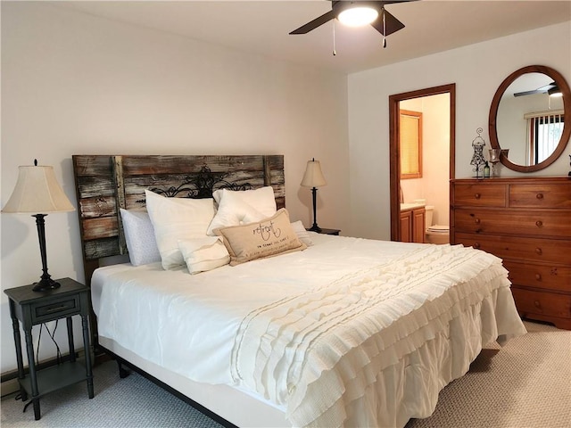 bedroom featuring carpet flooring, ceiling fan, and ensuite bathroom