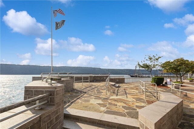 view of patio featuring a water view