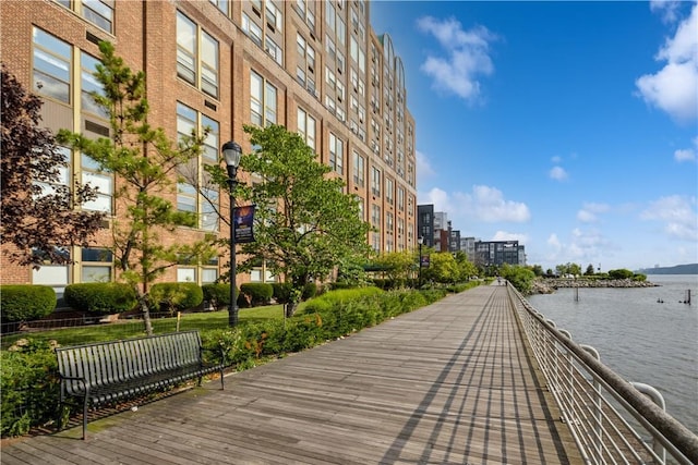 view of community featuring a water view and a view of city