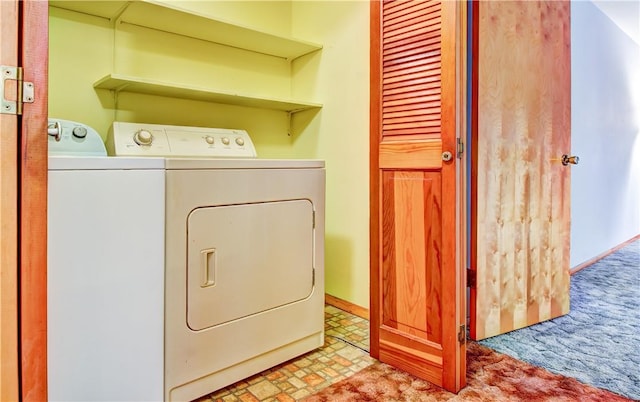 clothes washing area featuring washing machine and clothes dryer