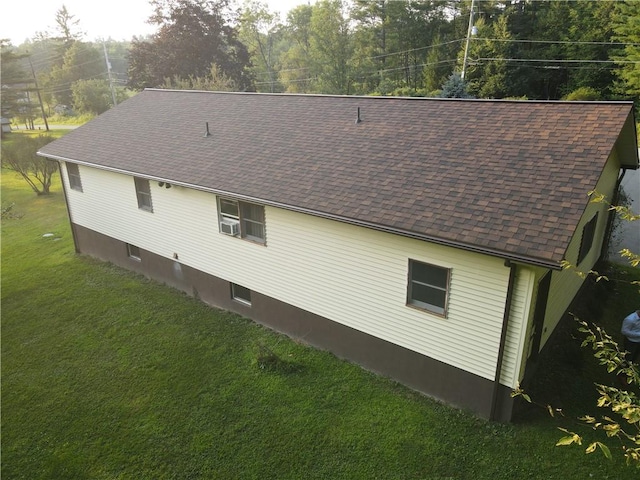 view of side of property with a yard