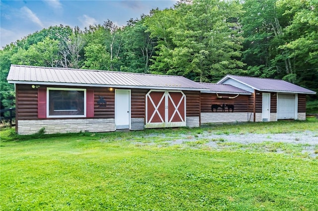 view of outbuilding with a lawn