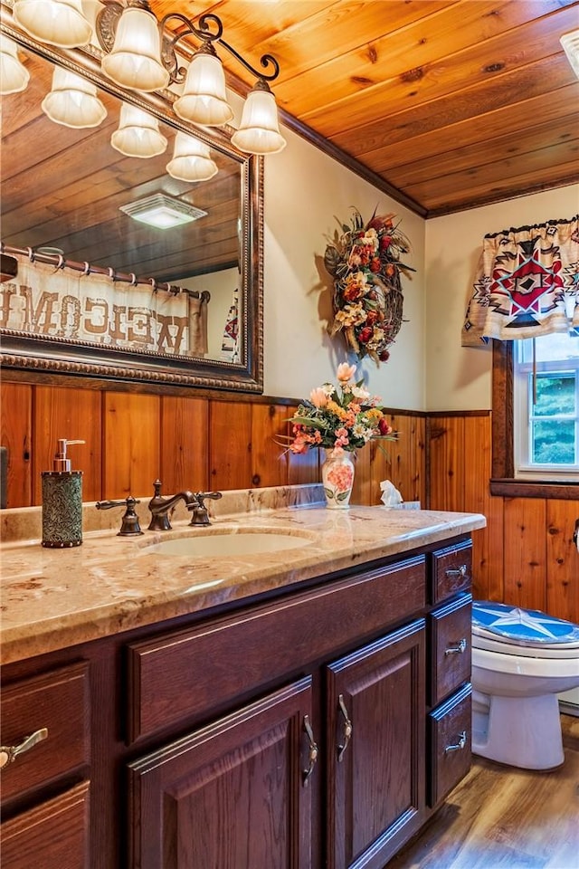 bathroom featuring wood ceiling, vanity, wood-type flooring, toilet, and wood walls