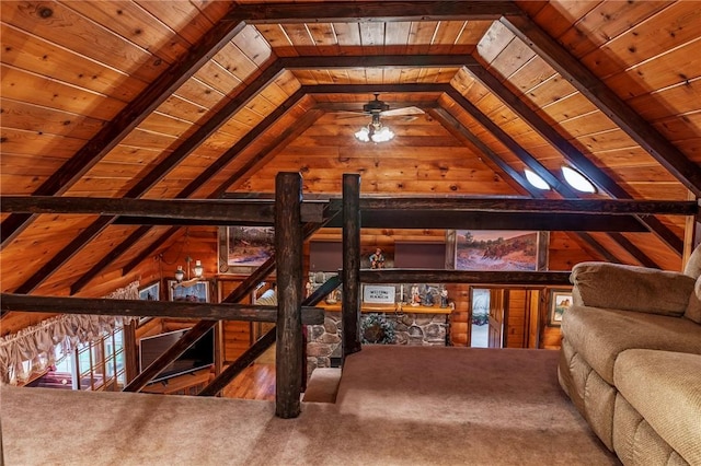 interior space featuring carpet, vaulted ceiling with beams, and wooden ceiling