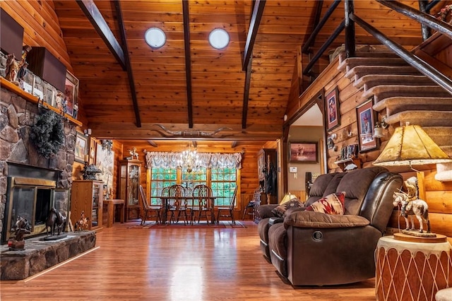 living room with beam ceiling, hardwood / wood-style floors, high vaulted ceiling, and wood ceiling