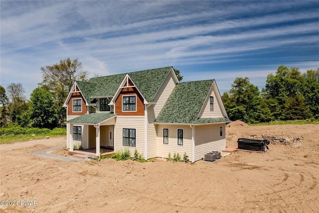 back of house featuring central AC