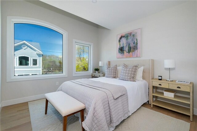 bedroom with light hardwood / wood-style flooring