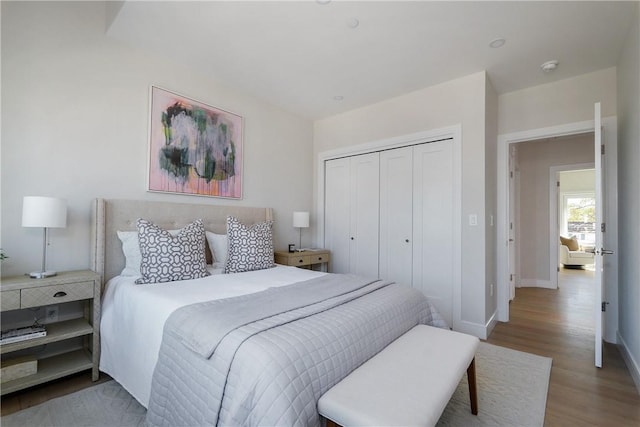 bedroom featuring a closet and light hardwood / wood-style floors