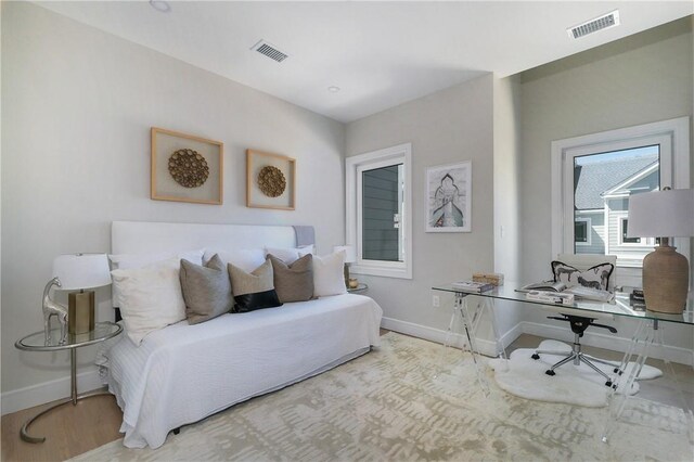 bedroom with light wood-type flooring