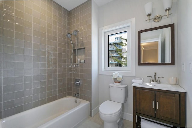 full bathroom featuring tile patterned floors, vanity, toilet, and tiled shower / bath combo