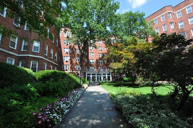 view of property's community with a lawn