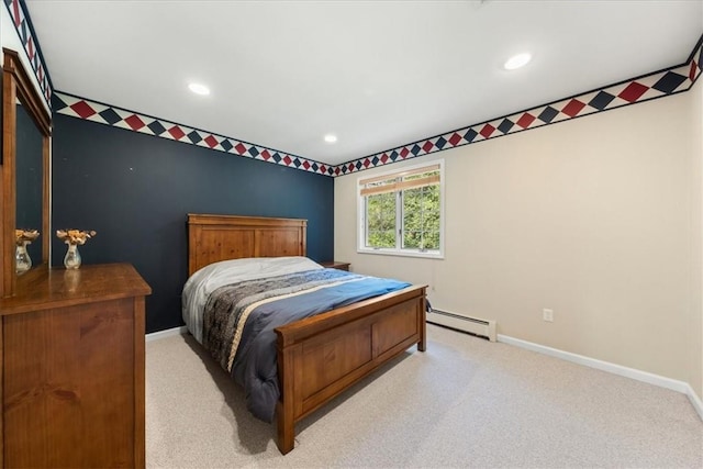 carpeted bedroom with a baseboard radiator