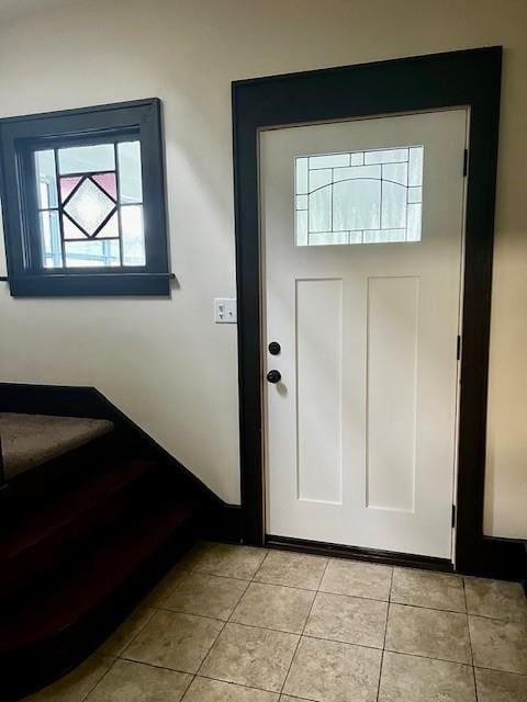 entryway with light tile patterned floors