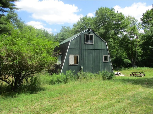 view of home's exterior with an outbuilding