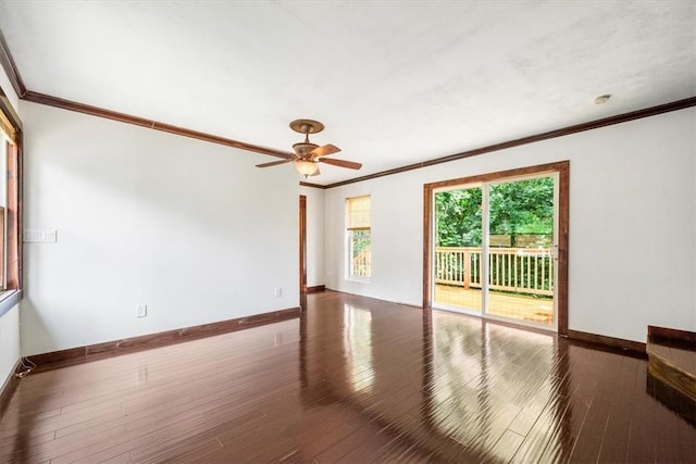 spare room featuring crown molding, ceiling fan, and dark wood-type flooring