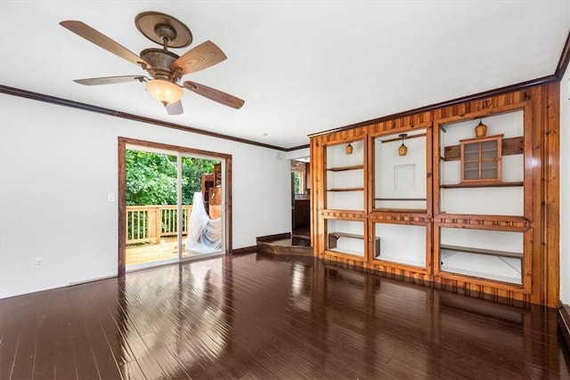 unfurnished room featuring hardwood / wood-style flooring, ceiling fan, and crown molding