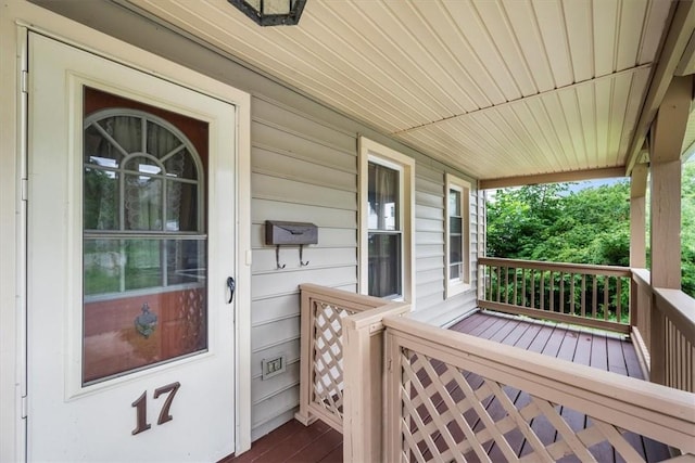 wooden deck featuring covered porch