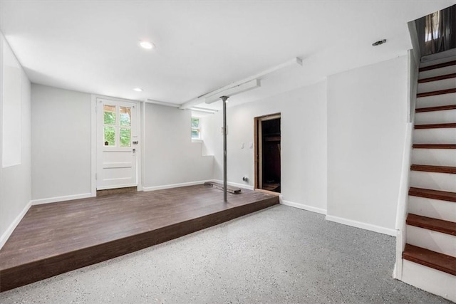 basement with hardwood / wood-style flooring