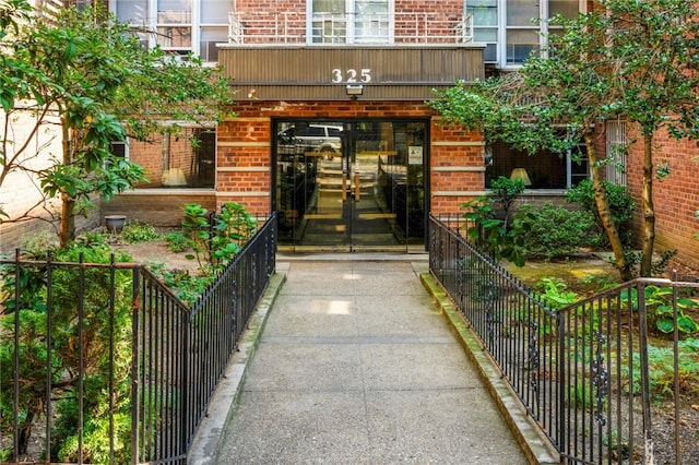 view of exterior entry featuring french doors