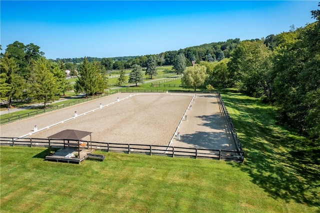 birds eye view of property with a rural view