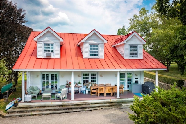 rear view of property with an outdoor hangout area and french doors