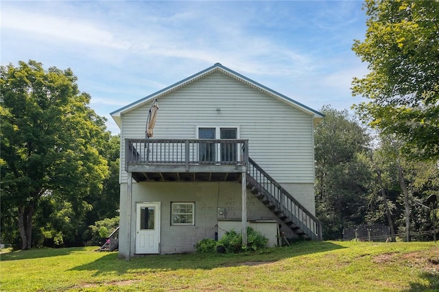 rear view of property featuring a yard