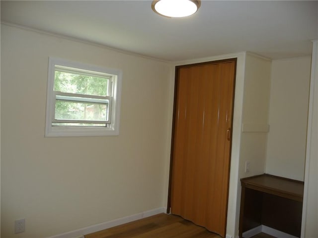 empty room with wood-type flooring