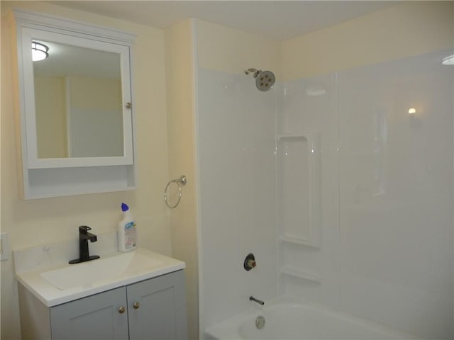 bathroom with vanity and bathtub / shower combination