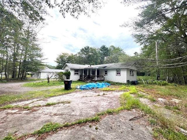 rear view of house featuring a deck