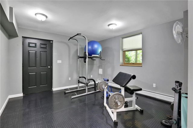 exercise room with a baseboard radiator