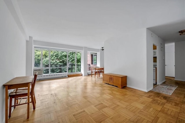 living room with light parquet flooring and a baseboard radiator