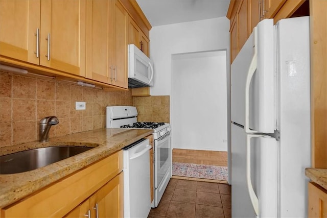 2727 Palisade Ave Unit 7B, Bronx, NY 10463 - kitchen with white appliances, tasteful backsplash, light stone counters, and dark tile patterned floors