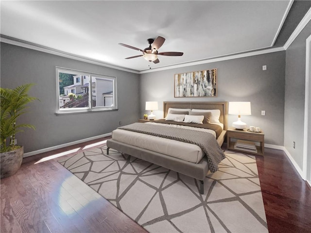 bedroom featuring ceiling fan, wood-type flooring, and ornamental molding