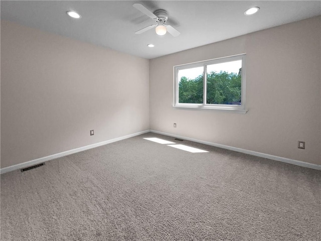 carpeted empty room with ceiling fan