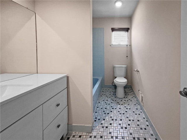 bathroom with tile patterned floors, vanity, and toilet