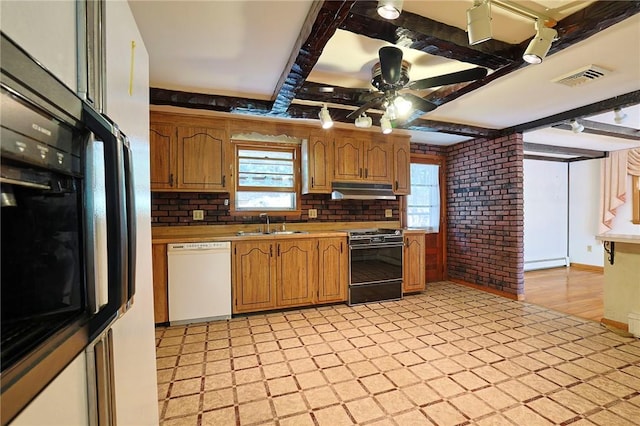 kitchen with backsplash, ceiling fan, baseboard heating, black appliances, and beam ceiling