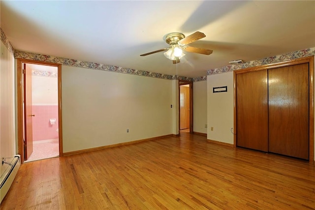 unfurnished bedroom featuring a closet, ceiling fan, light hardwood / wood-style flooring, and a baseboard radiator