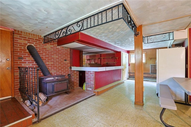 living room featuring a wood stove