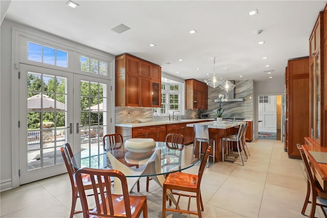 dining space featuring recessed lighting, french doors, and light tile patterned flooring