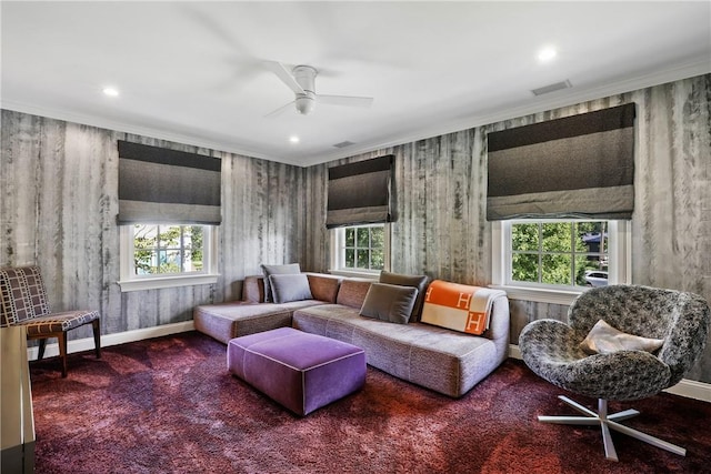 living room with plenty of natural light, carpet flooring, baseboards, and ceiling fan