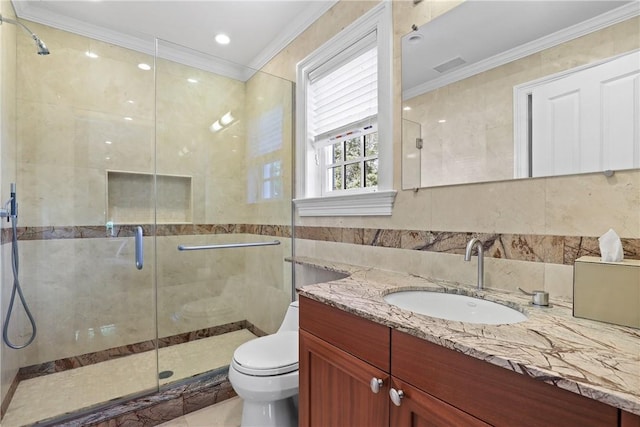 bathroom featuring toilet, tile walls, ornamental molding, and vanity