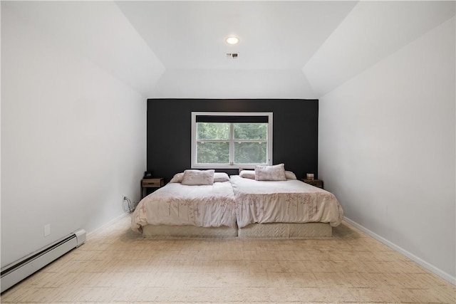 bedroom with a baseboard radiator and vaulted ceiling