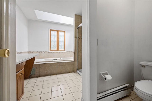 full bathroom with a skylight, baseboard heating, tile patterned flooring, toilet, and vanity