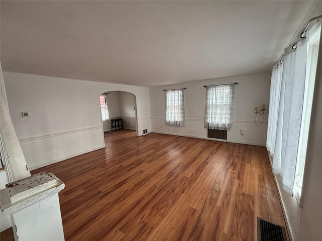 unfurnished living room featuring hardwood / wood-style flooring