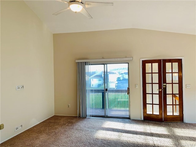 unfurnished room featuring carpet flooring, ceiling fan, french doors, and lofted ceiling