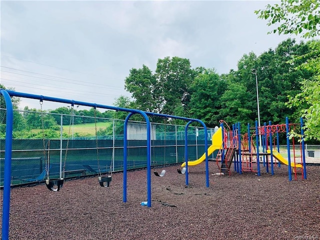 view of playground featuring tennis court